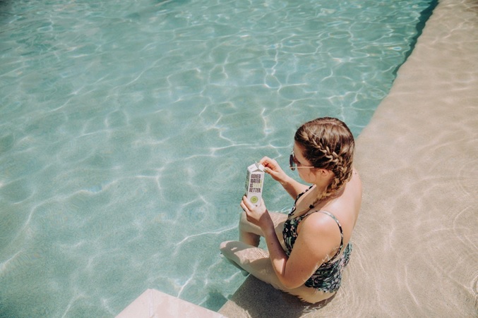 A picture of a person in the pool on their vacation with her Royal Holiday membership